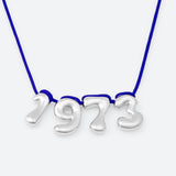 COLLIER AVEC QUATRE NUMÉROS