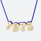 COLLIER AVEC QUATRE NUMÉROS