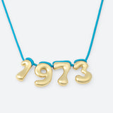 COLLIER AVEC QUATRE NUMÉROS