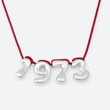 COLLIER AVEC QUATRE NUMÉROS