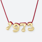 COLLIER AVEC QUATRE NUMÉROS