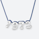 COLLIER AVEC QUATRE NUMÉROS
