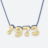 COLLIER AVEC QUATRE NUMÉROS