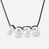 COLLIER AVEC QUATRE NUMÉROS