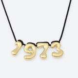 COLLIER AVEC QUATRE NUMÉROS