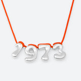 COLLIER AVEC QUATRE NUMÉROS