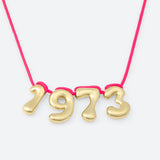 COLLIER AVEC QUATRE NUMÉROS