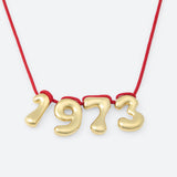 COLLIER AVEC QUATRE NUMÉROS
