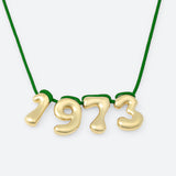 COLLIER AVEC QUATRE NUMÉROS