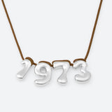 COLLIER AVEC QUATRE NUMÉROS