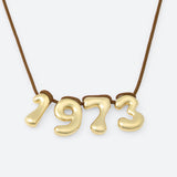 COLLIER AVEC QUATRE NUMÉROS