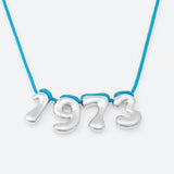 COLLIER AVEC QUATRE NUMÉROS