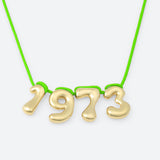 COLLIER AVEC QUATRE NUMÉROS