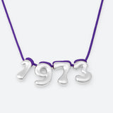 COLLIER AVEC QUATRE NUMÉROS